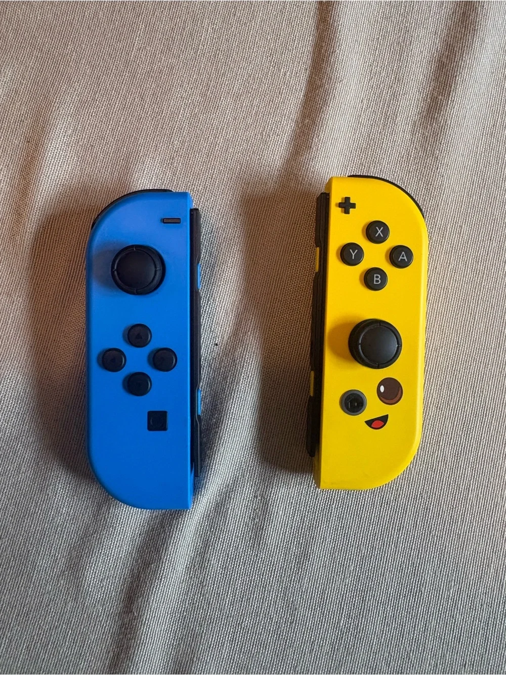 Nintendo Switch with Blue Left and Yellow Right Joy‑Con Controllers
